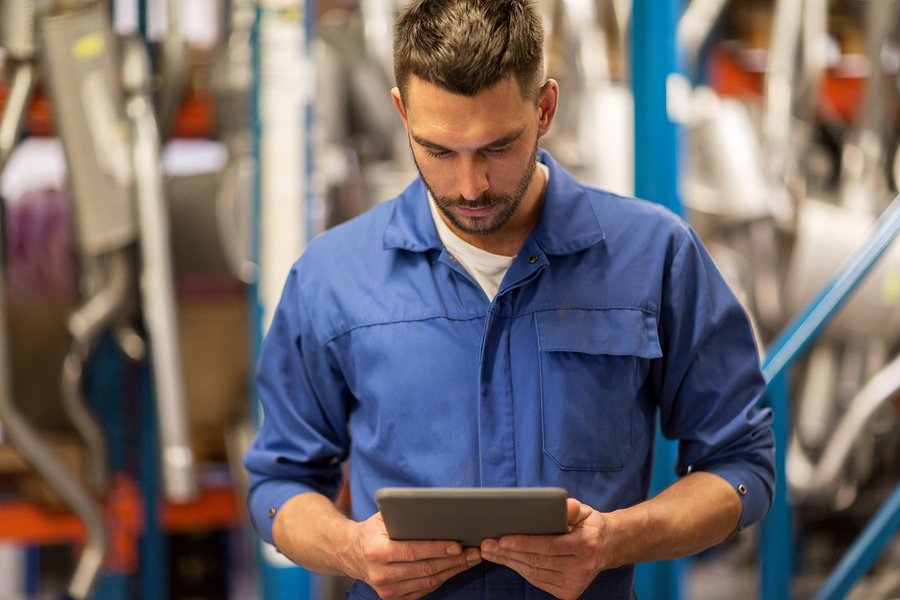 Technician documenting job on phone or tablet